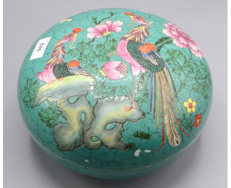 A Chinese famille verte circular box and cover, decorated with a flowering tree and exotic birds perched on a rocky outcrop, 