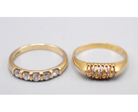 A 9ct. gold ring set with five diamonds in a contemporary style and an 18ct. gold ring set with five small diamonds in Victor