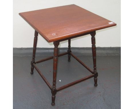 An Aesthetic Movement mahogany occasional table, probably retailed by Liberty & Co., the square top with flared, ring turned 