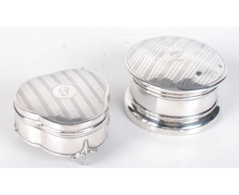 A trefoil shaped engine turned silver ring box and one other engine turned silver ring box.