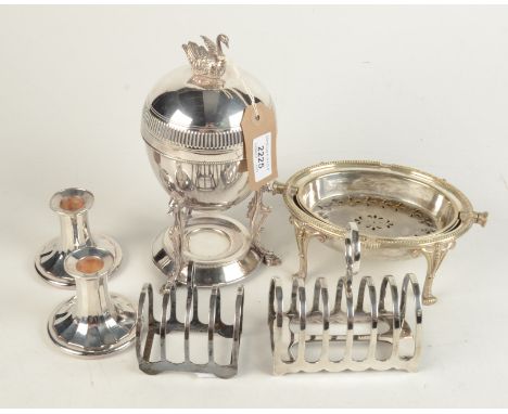 An egg coddler, the cover with swan finial, together with a pair of candlesticks, two toast racks and a small revolving dish.