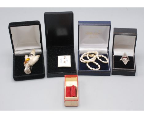 An Art Deco style marquisetoned garnet ring, together with a pearl necklace with gold clasp etc.