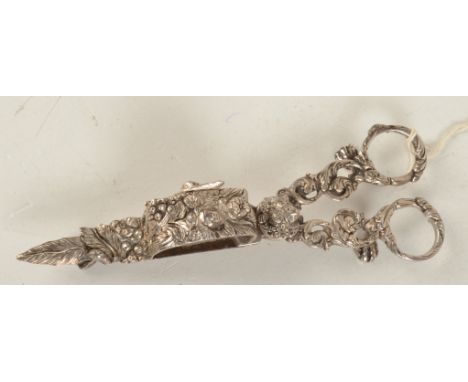 A pair of ornate silver scissor candle snuffers by Samuel Whitford II London 1825. 6.7oz.   Condition report:  Two holes in s