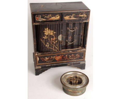 A Japanese black lacquered table cabinet, height 34cm, a similar box and a circular brass cased barometer. 