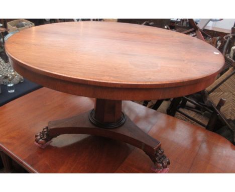 A Victorian rosewood veneered snap top pedestal table with tripod plinth base and claw carved feet, diameter 121cm.