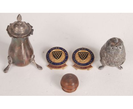 A miniature treen beehive pot, 19th century, height 2cm, diameter 2cm and two enamel pin badges inscribed 'English China Clay