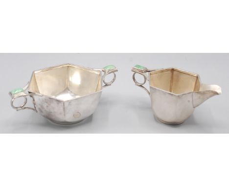 An Art Deco hexagonal section milk jug with a jade thumbpiece above the ring handle by A.E. Jones, Birmingham ,1936, together