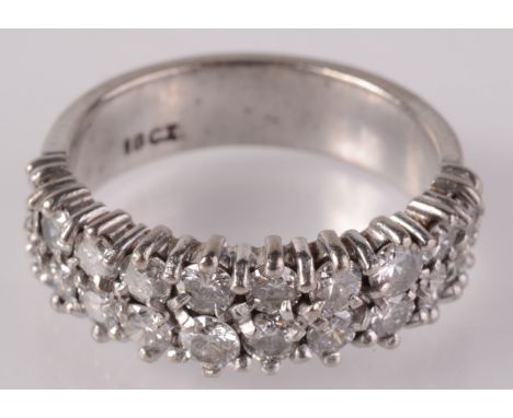 An 18ct white gold ring set two rows of ten diamonds. 