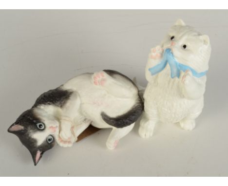 Two Royal Worcester porcelain kittens entitled 'White Persian', length 12cm and 'Black & White', length 15cm. 