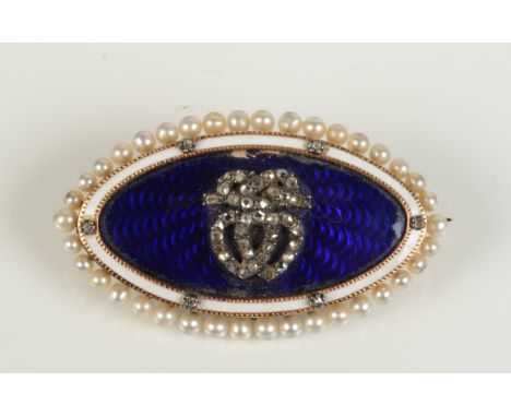 A Georgian style gold brooch with conjoined diamond set hearts on a blue enamel ground within a diamond set white enamel boar