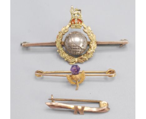 A white and yellow 9ct gold and enamel Marines brooch, together with two other gold brooches.