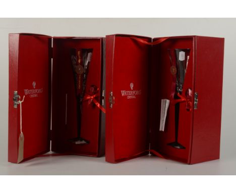 Two Waterford Crystal Limited Edition champagne flutes, both part of the 'Twelve Days of Christmas' collection, complete with