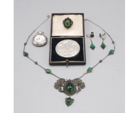 A green paste filigree silver necklace, similar earrings and ring, a small silver fob watch and an Etonian medal. 
