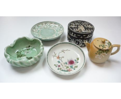 A Chinese famille rose porcelain saucer dish, diameter 11.7cm, celadon bowl and dish, teapot and wooden jar.