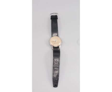 An Omega gentleman's stainless steel cased wristwatch with gold hands, blued sweep second hand, gold arab numerals and black 