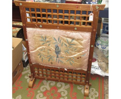 A Japanese oak framed fire screen, late 19th/early 20th century, set with hardstone diamond motifs, the centre with a rectang