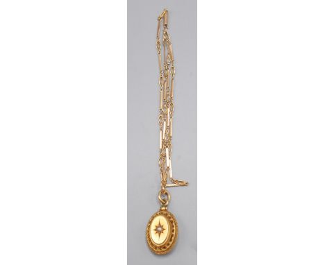 A Victorian high purity roman revival gold pendant set a pearl on 15ct gold chain, 7.35g. 