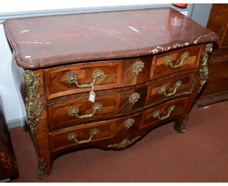 A good Louis XV style bombe commode, with later marble top and gilt metal masks, the three long drawers on bracket feet, heig