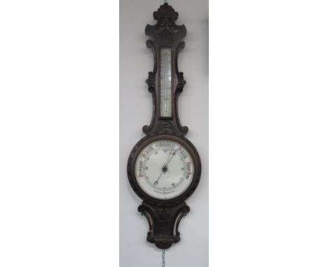 A late Victorian oak aneroid barometer, height 89cm.