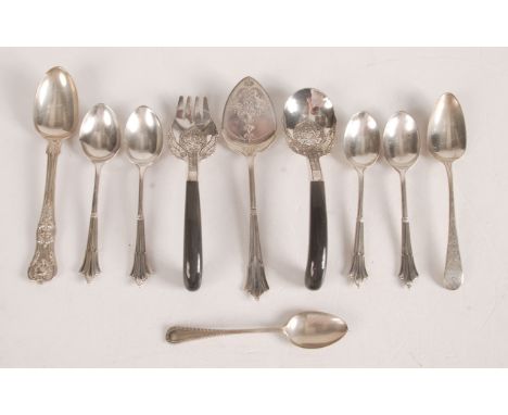 Various silver spoons and an eastern engraved silver coloured metal fork and spoon with horn handles.