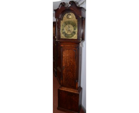 A George III oak and mahogany crossbanded longcase clock, the arched brass dial signed Jn'o Winstanly, Holywell, flanked by r