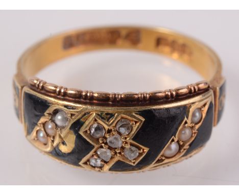 A 15ct gold late Victorian, black enamel mourning ring set a diamond cross and pearls, Chester 1900.   Condition report:  Dam