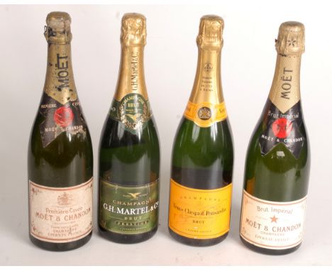 Four bottles of non-vintage champagne.