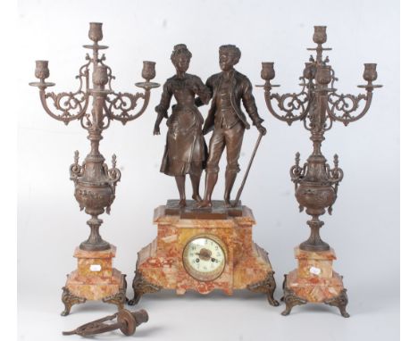 A continental red marble figural clock garniture, late 19th century, the 8.5cm enamel dial surmounted by a spelter loving cou