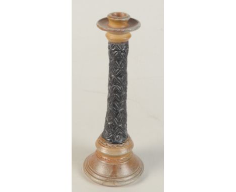 A Leach Pottery candlestick, the black stem with geometric decoration, circular plinth base, incised marks to base, height 28