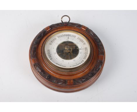 A German circular aneroid barometer, the 13cm dial inscribed 'F.Kochendorffer, Berlin'. 