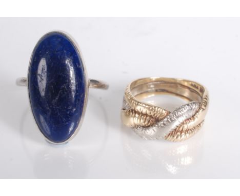 An 18ct gold ring and a Ruskin silver ring with a deep blue oval panel, impressed mark Ruskin.   Condition report:  Gold ring