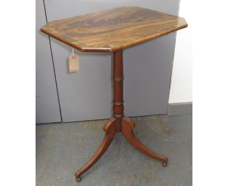 A mahogany tilt top tripod table, the octagonal crossbanded top on a turned stem, on fluted downswept supports, height 74cm, 