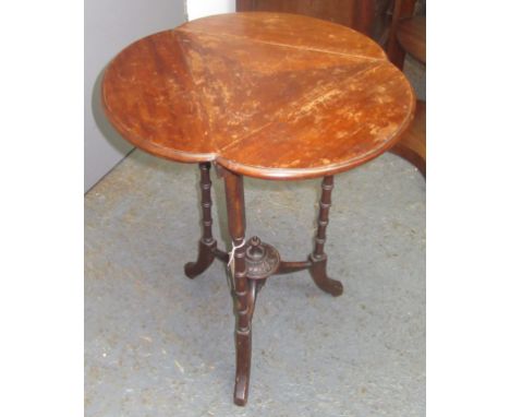 A Victorian drop leaf corner table, the triangular moulded top on ring turned supports, height 63cm and a mahogany oval three