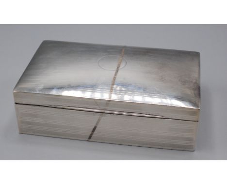 An engine turned cigarette box.