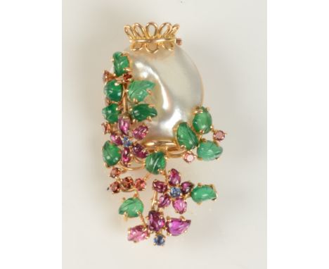 A post war gold brooch in the form of a vase of flowers with a baroque pearl, emeralds, rubies and sapphires. 