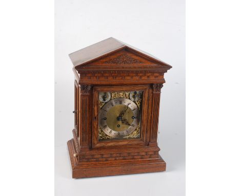An oak cased bracket clock, late 19th century, with a triple fusee movement by Winterhalder & Hofmeier, the rectangular brass