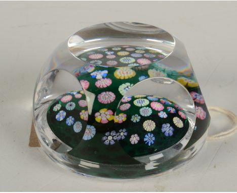 A Whitefriars Millifiori paperweight, cut with windows on a green ground, diameter 7.8cm.   Condition report:  Sl scratched o