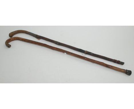 A swordstick, length 91.5cm and a walking stick.