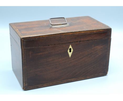 A George III mahogany rectangular tea caddy, the interior with two lidded compartments, height 13cm, length 22.5cm.   