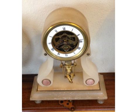 A 19th c swinging cherub mantle clock