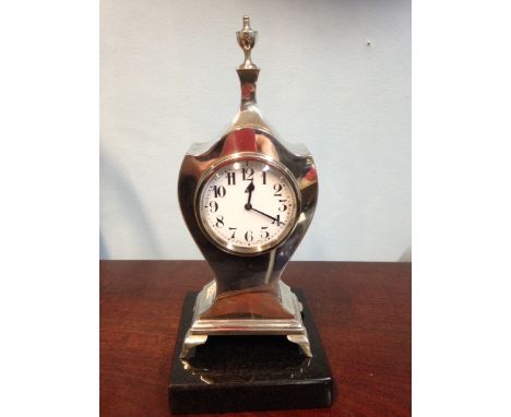 A small silver mantle clock B'ham 1921