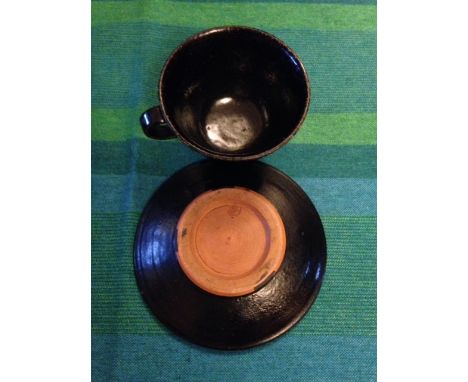 Dartington Pottery black cup and saucer reputedly made by Bernard Leach when working at the pottery in the 1920's