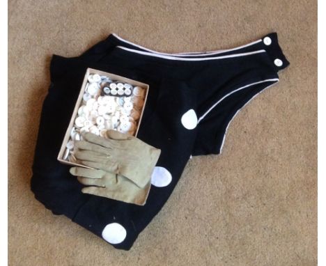 A 1920's bathing costume, child's kid gloves and a box pearl buttons