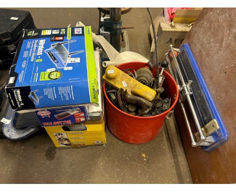 Mixed Lot: Wireless router, tile cutter and a spray station and a metal tub of assorted tools and a further wood mounted tile