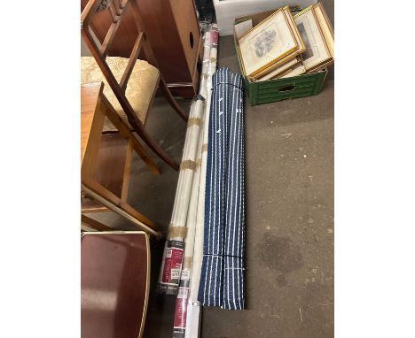 A group lot of roller blinds and floor mats