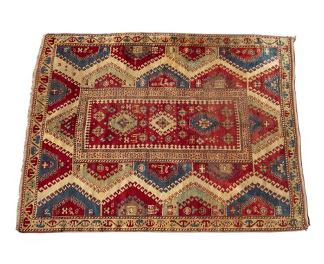 An antique 20th century Borchalou Kazak rug 240cm x 190cmOne corner with tear, frayed. Small bit of moth damage noticed. Seem