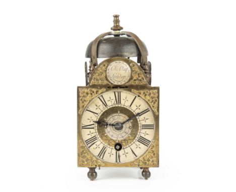 A George III brass alarm lantern clock by Charles Clay London , the silvered dial with roman numerals 11cm wide 9cm deep 22cm