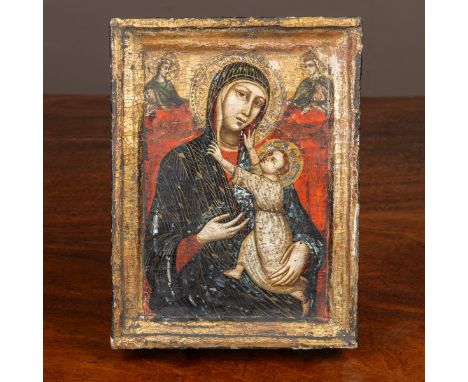 An icon in the manner of Cimabue depicting the Madonna and child with two saints, oil and gilt on board 24cm x 18cmCracking t