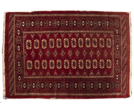 A middle eastern red ground rug with geometric decoration 90cm x 158cm and another rug (2)