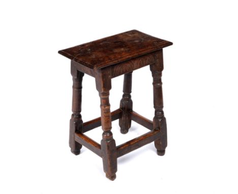 A 17th/18th century oak joint stool with turned supports 46cm wide 28cm deep 56cm high 